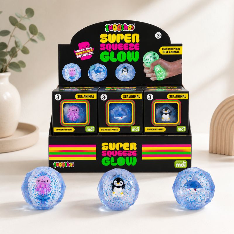 Smooshos Super Squeeze Glow Sea Animal retail display with three blue diamond sphere squishy toys