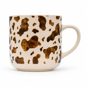 Splosh - Saddle & Bloom Cow Mug on a cream-colored base, featuring a curved handle on the right side.