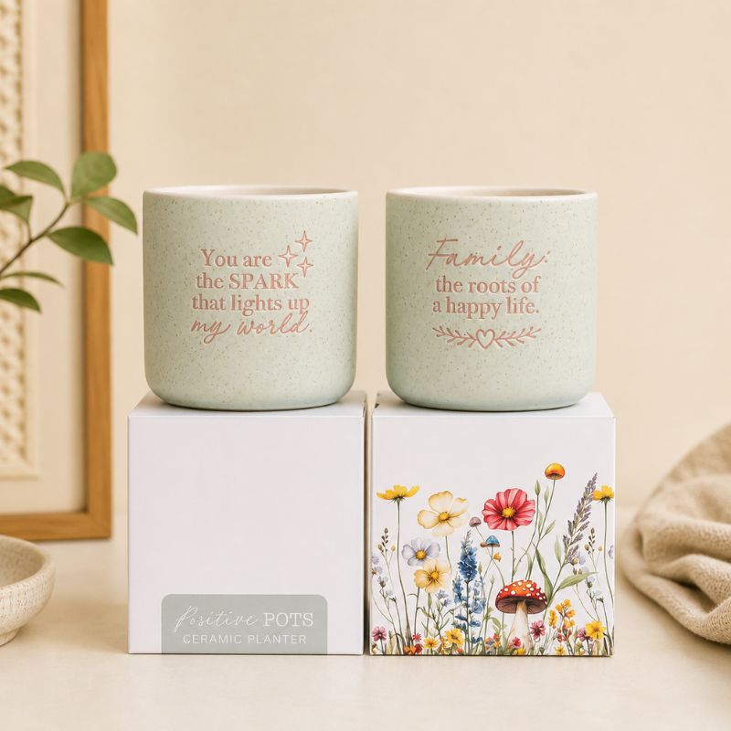 Set of ceramic quote planters in sage green with inspirational messages on beige background