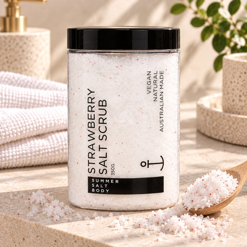 Summer Salt Body Strawberry Salt Scrub styled on a light stone bathroom vanity
