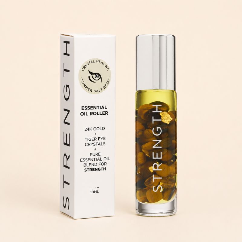 Essential oil roller with packaging on a beige background