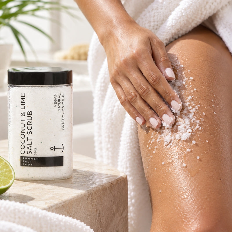 Woman applying Coconut and Lime Salt Scrub to her leg during a body-care routine