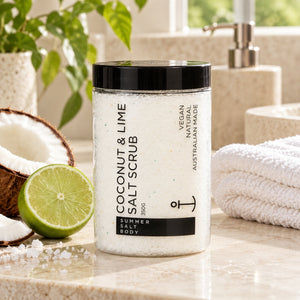 Summer Salt Body Coconut and Lime Salt Scrub styled in a bright spa-inspired bathroom