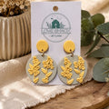 Sunshine Flower Dangle Earrings on a 'Love Shack Giftware' card with a natural background.