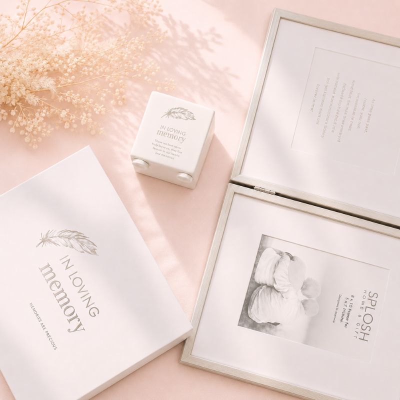 Album with 'A Moving Memory' text, photo of a woman, and small box on a pink surface.