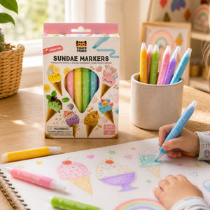 Kids drawing with bright scented markers at desk
