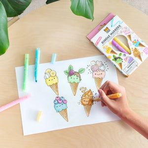 A hand drawing with markers at desk