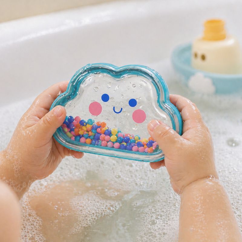 Child holding Tiger Tribe colourful cloud bath shaker toy during bath time play