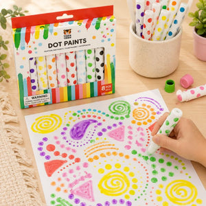 Colorful Tiger Tribe dot paint set with packaging, paintbrushes, and child's hand making designs on paper. - Loveshack Giftware