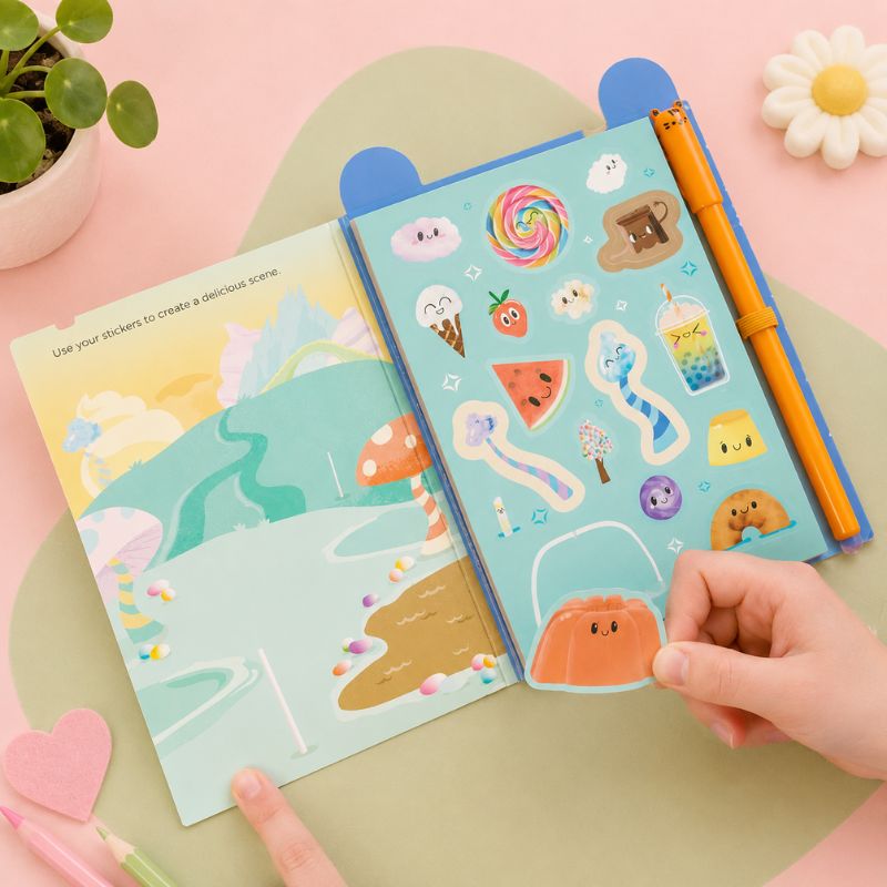 Colorful sticker book with cute illustrations on a pink surface