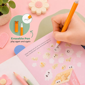 Erasable pen being used on a pink notebook with cartoon popcorn designs, surrounded by stationery items.