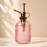 Pink glass spray bottle with brass nozzle on a beige background-Loveshack GIftware