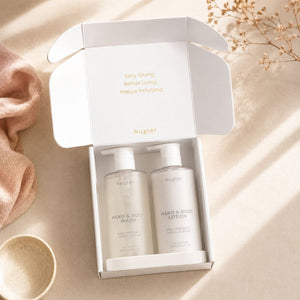 Open Huxter Wash and Lotion Gift Set with Pink Pepper & Vanilla Bean pump bottles in premium gift packaging