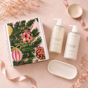 Huxter Pink Pepper & Vanilla Bean Wash and Lotion Gift Set flat lay with illustrated gift box and silicone tray