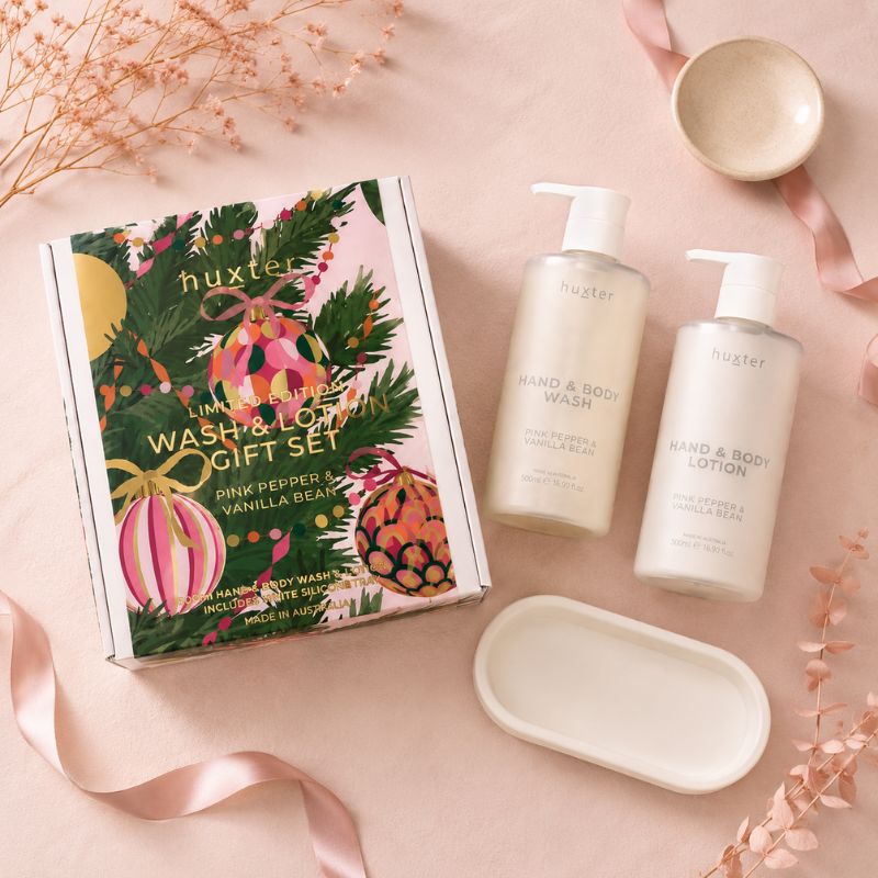Huxter Pink Pepper & Vanilla Bean Wash and Lotion Gift Set flat lay with illustrated gift box and silicone tray