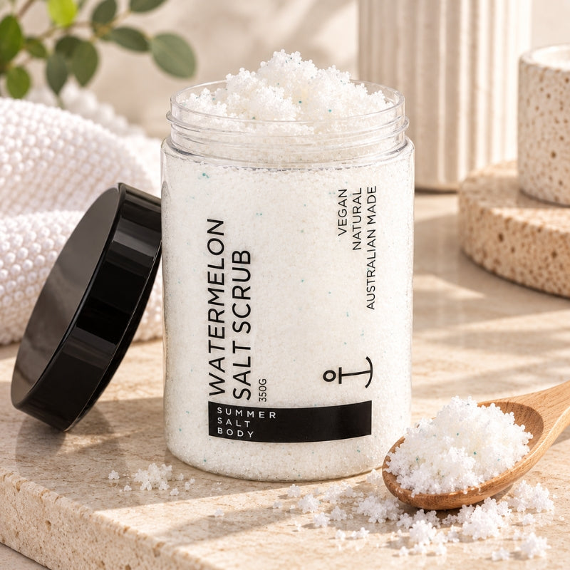 Open Watermelon Salt Scrub tub styled with scrub crystals and spa accessories