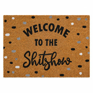 A rectangular coir doormat with the phrase 'WELCOME TO THE Shitshow' in black lettering, surrounded by scattered black, white, and gray polka dots on a natural brown background.-Welcome to the Shitshow Doormat Black