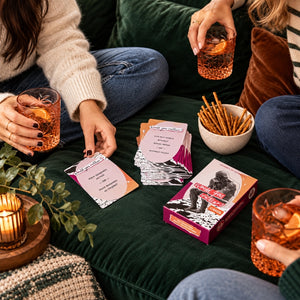 Friends playing Journey of Something Would You Rather cards during a cozy game night